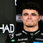 Lando Norris, juara dunia baharu dan pemandu McLaren yang meraih tempat ketiga, meraikan detik emosinya di podium selepas Grand Prix Abu Dhabi di Litar Yas Marina/ Foto AFP